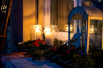 Candle in a glass burns in the dark