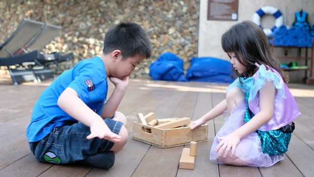 kid building wood blocks, plan and strategy