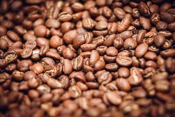 Beans of roasted coffee, macro photo.