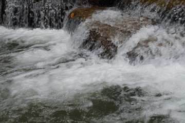 water flowing over the rocks.