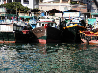 Fototapeta na wymiar Fishing vessels in Aberdeen harbor, Hong Kong Island