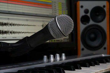 home recording studio. Screen keyboard, speakers and microphone.