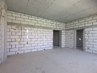 Construction Site of a modern house on a plot of land. No People present.