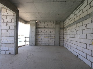 Construction Site of a modern house on a plot of land. No People present.
