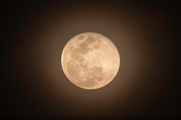 Full moon over dark black sky at night with telephoto lens isolated on transparent background.