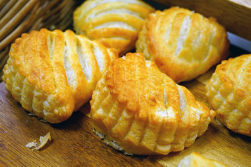 Fresh chausson aux pommes turnovers in a French pastry shop
