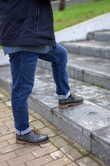 Senior man with a beard walking in the city