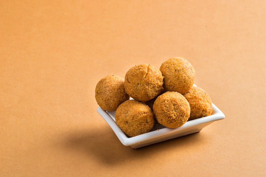 Kachori or Kachauri or Kachodi or Katchuri is a spicy snack, snacks with tea and green salad and tomato ketchup
