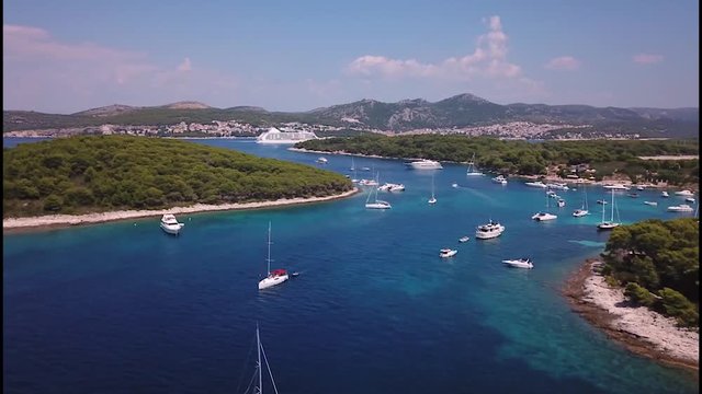 Drone time lapse of passing boats and a large cruise ship close to the island of Hvar