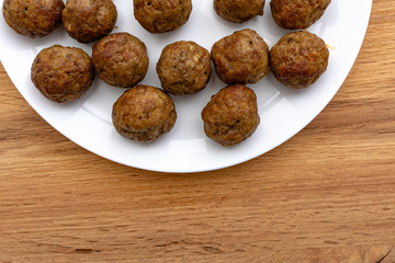 Delicious rustic roasted meatballs with carrot and onion