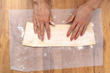 Baker making puff pastry baking