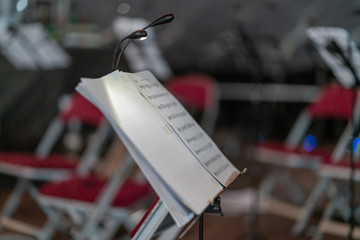 Note sheets on the note stand at the stage