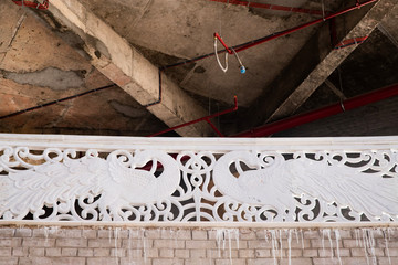 a beautiful decorative detail of stucco in the Indian temple under construction.