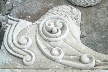 a beautiful decorative detail of stucco in the Indian temple under construction.