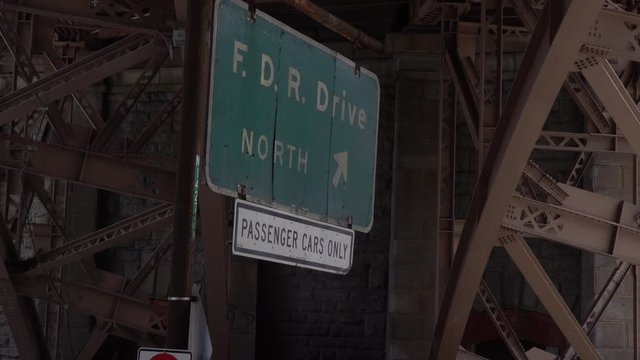 FDR Drive North  - Traffic Sign in New York City for passenger cars, located near an underpass highway ramp