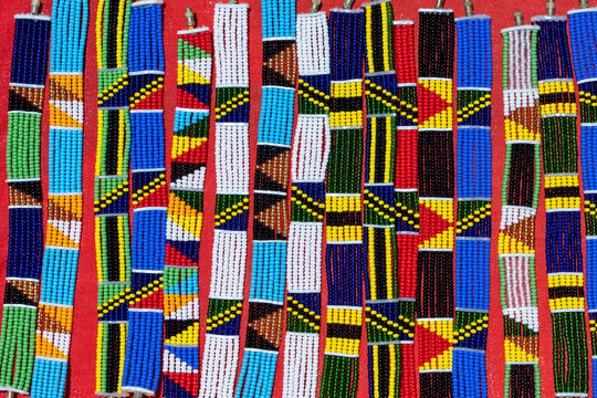 Tribal masai colorful bracelets for sale for tourists at the beach market, close up. Island of Zanzibar, Tanzania, Africa