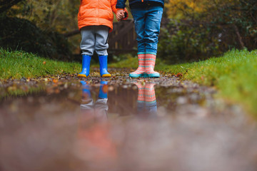 children holding hands at plash