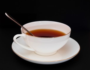 tea in a white cup on a saucer