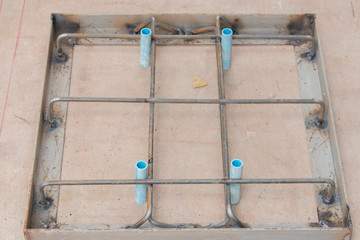 Steel bars welded together as a frame for making manhole covers