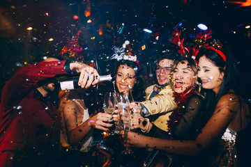 Group of friends having fun at New Year's party