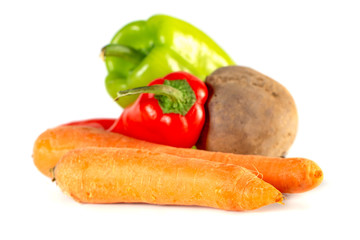 Carrots, beet, sweet red and green peppers isolated on white background.