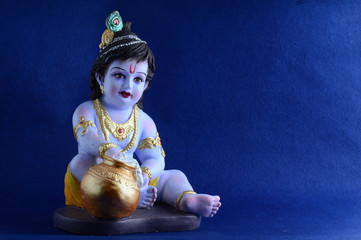 Hindu God Krishna on blue background
