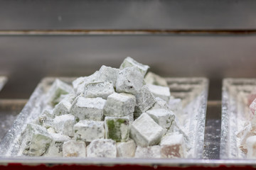 Authentic Turkish delight, arranged on trays, blurred background. In the market in Jerusalem.