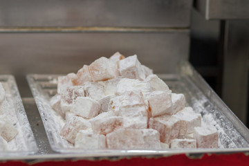 Authentic Turkish delight, arranged on trays, blurred background. In the market in Jerusalem.