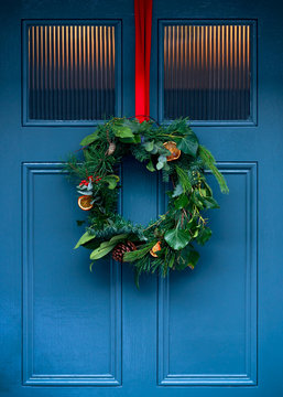 Christmas holiday wreath on beautiful entrance door