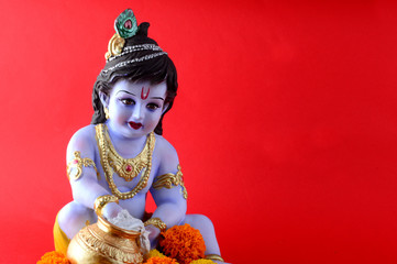 Hindu God Krishna on red background