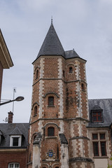 Obraz premium Logis du Roi, a former hotel known as Trois-Cailloux, is a brick and stone building with tower housing a spiral staircase, from beginning of XVI century. Amiens, Picardy, Somme, France.