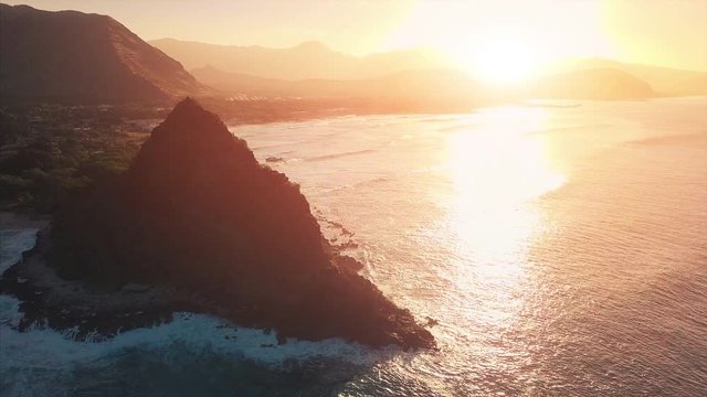 Aerial view of the west coast of the island of Oahu during sunrise