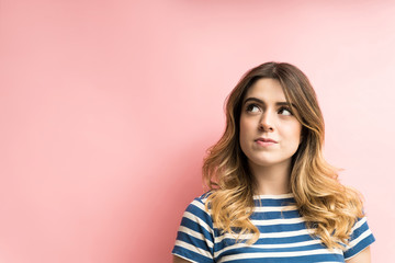 Young woman looking at copy space