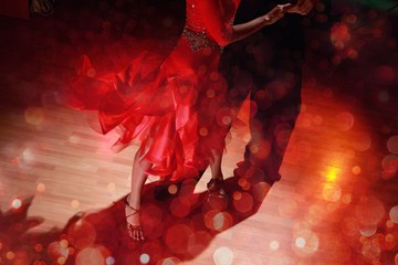 Man and a woman dancing Salsa on background