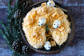 Salad symbol of the new year 2020 white rat. Mice in a cheese salad. Christmas dish.