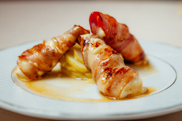 Suluguni cheese wrapped in bacon
