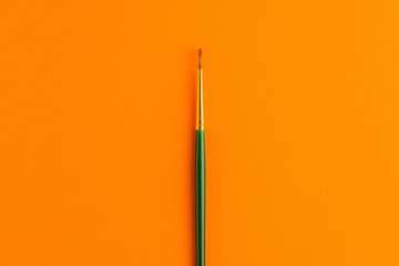 Paintbrush Isolated On Orange Background