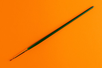 Paintbrush Isolated On Orange Background