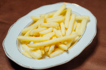 French fries on a white plate