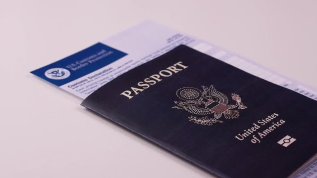 American passport with a customs declaration form on a white background. Close-up