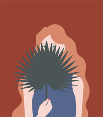 Girl holding tropical palm leave, brown background