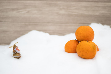 Tangerines for the New Year lie in the snow