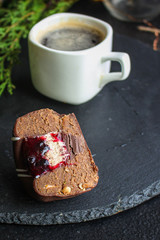 chocolate cake with filling, festive table setting (coffee, gifts, sweets) menu concept. food background. top view. copy space