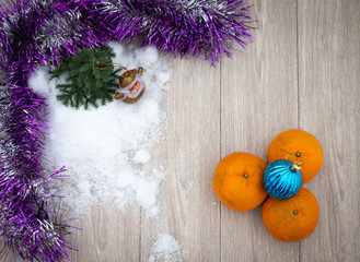 Obraz na płótnie Canvas Tangerines for the new year with toys