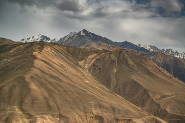 Fototapeta na wymiar View on the mountains in Pamir highway in Tajikistan sharing with afghanistan border