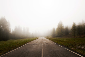 Foggy street in Italy. Dolomites.