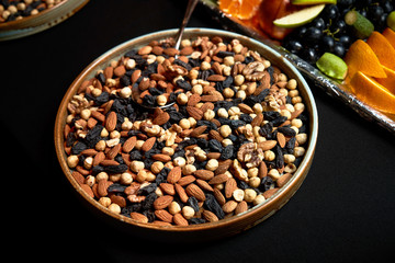 Nuts background with almonds hazelnuts walnuts raisins