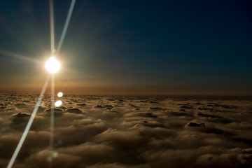 sun above the clouds, the view from the plane