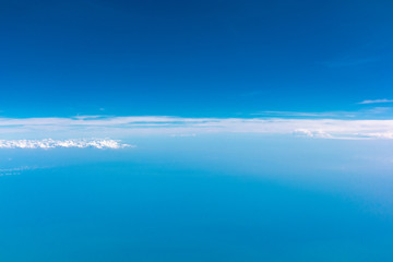 Blue sky and white clouds, the view from the plane window