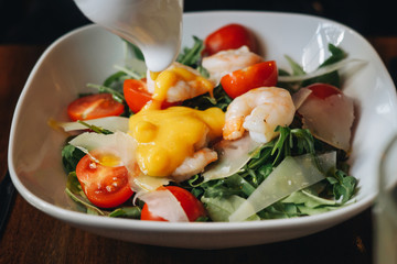 Salad with shrimps mango sauce cheese cherry greens